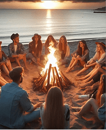 Группа людей у костра на пляже на закате